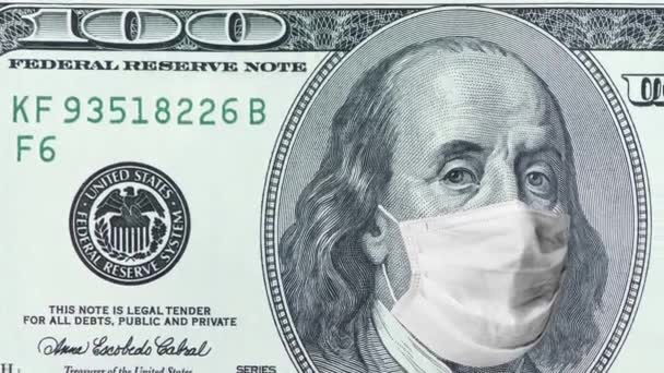 Old One hundred dollar bill with protective medical face mask on Benjamin Franklin in christmas hat. Economic Crisis during Covid-19 Pandemic concept. 100 dollar banknote. 4k high quality footage — Stock Video