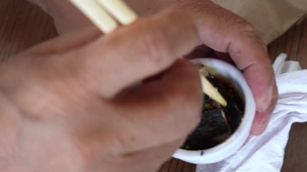 Closeup Soaking Eating California Maki Black Sauce Wooden Chopsticks White — Video Stock