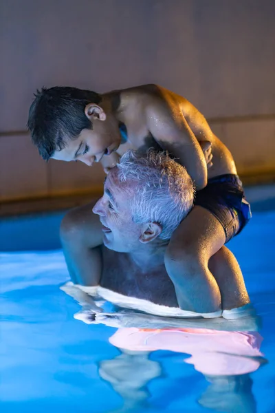 Grandfather Grandson Playing Swimming Pool Night — Stock Photo, Image