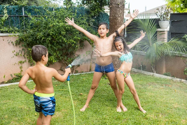 Three Funny Kids Playing Hose Garden — Stock Photo, Image
