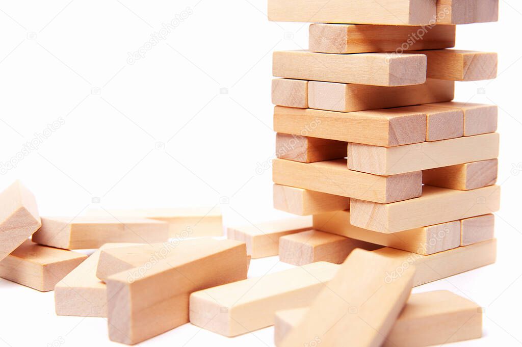 block wooden play isolated on white background. Construction and development concept 