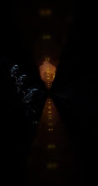 Halloween night celebration with three dancing skeletons dance around a smoke bomb pumpkin with glowing eyes animation arc shot camera movement vertical video