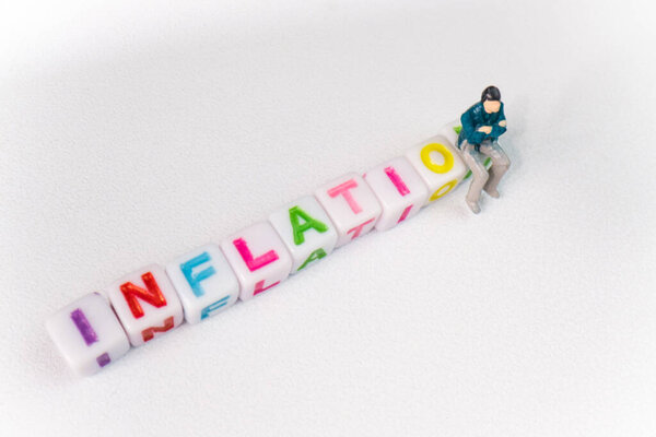 фон Inflation toy cubes and miniature man