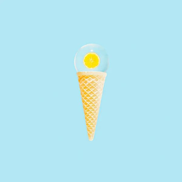 Creative aesthetic summer sunrise scene. Ice cream cone with slice of fresh orange reflected in a glass sphere on bright blue background. Summer vibes, tropical fruit composition.