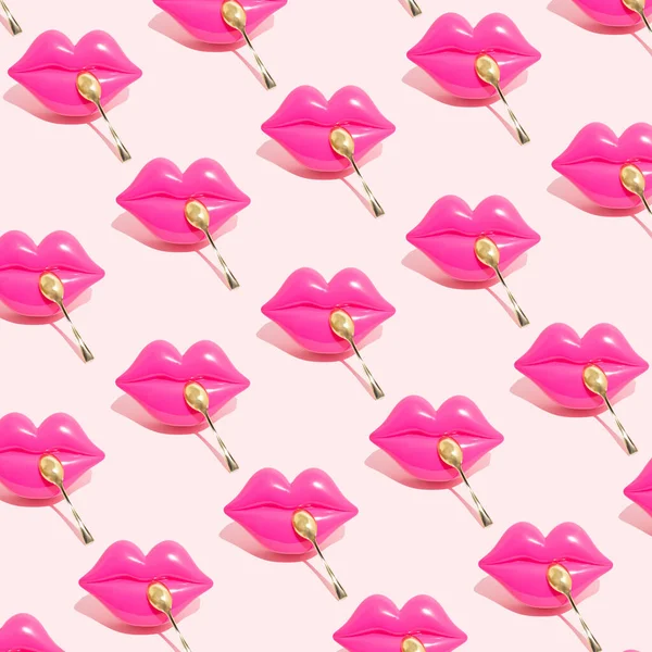 Creative seamless pattern of pink kiss lips with golden spoon isolated on a pastel pink background. Sexy sensual female lips. Concept of beautiful kiss, tasty, sweet food or dessert lovers.