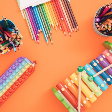 Trendy back to school composition with colorful school supplies. Flat lay, space for copy space.