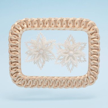 Pastel mavi arka planda altın çerçeveli iki kar tanesiyle son moda sakin kış sahnesi. Noel ve Yeni Yıl kompozisyonu.