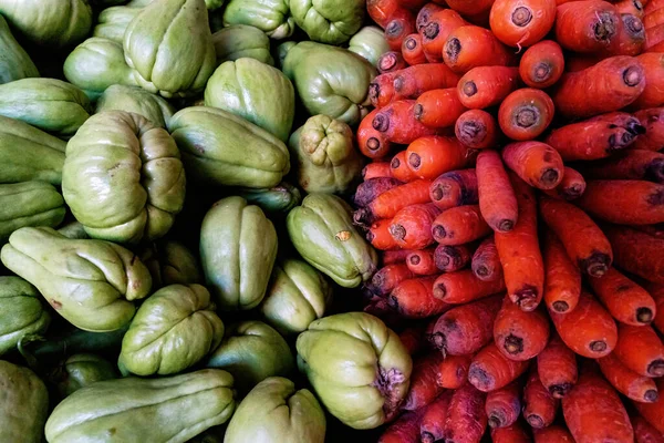 Colorful vegetables of orange carrots and green squash from a Mexican food market in Puerto Vallarta