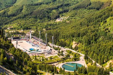 Almaty, Kazakhstan - june 17 2017 : the ski and ice skating resort of shymbulak within the zailiyskiy alatau mountain range. the ice skating stadium was the most important of the soviet union