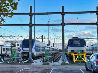 Voorburg, Netherlands - November 05 2021 : 2021 : a dutch rail yard with several fast trains parked on tracks waiting repair