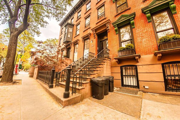 New York, United States - April 20, 2012 : The stoop steps stairs to an old house in Brooklyn of bricks.