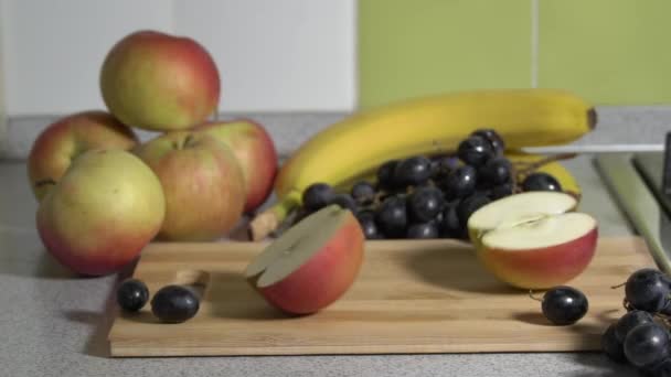 Woman Hands Cut an Apple on a Plank With a Knife. — Stockvideo