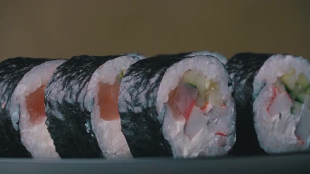 Sushi Roll Turned on a Green Background. — Video Stock