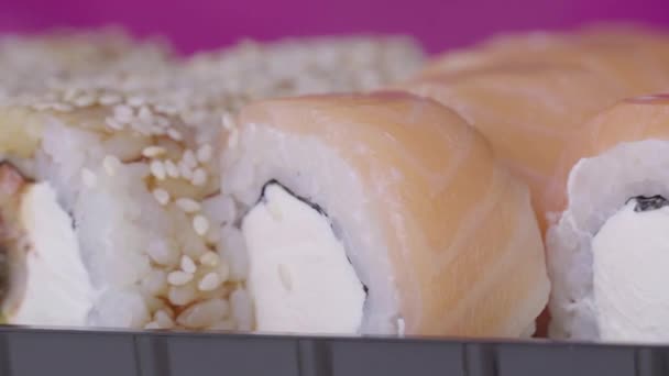 Sushi Roll Turned on a Pink Background — Stockvideo