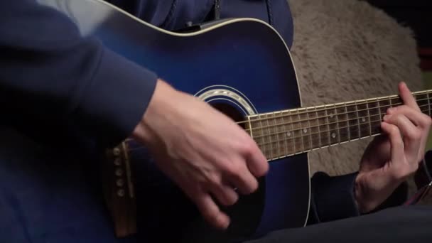 Man Plays a Pick on a Modern Guitar in the Dark — Stock Video