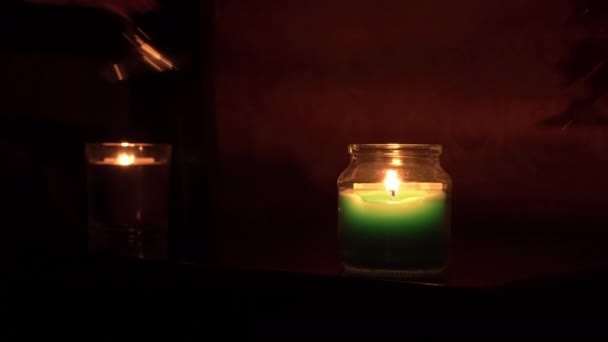 The Guy and the Girl Drink Wine by Candlelight in the Evening Near the Bed — Stock video