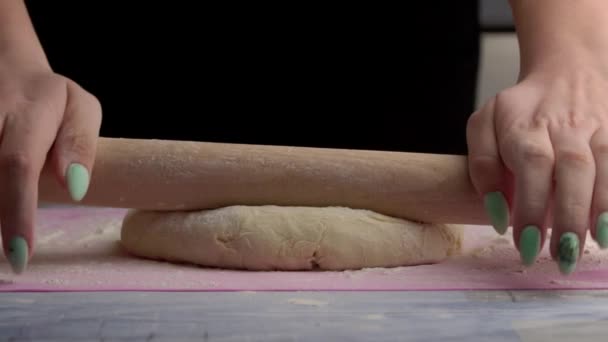 Young Girl Rolls Out Raw Dough with a Rolling Pin in Slow Mo — Stock Video
