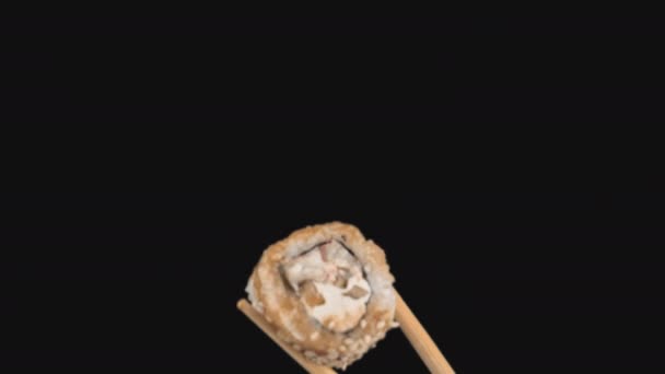 Female Hands Hold Japanese Chopsticks with Sushi Rolls on Transparent Background — Stock Video