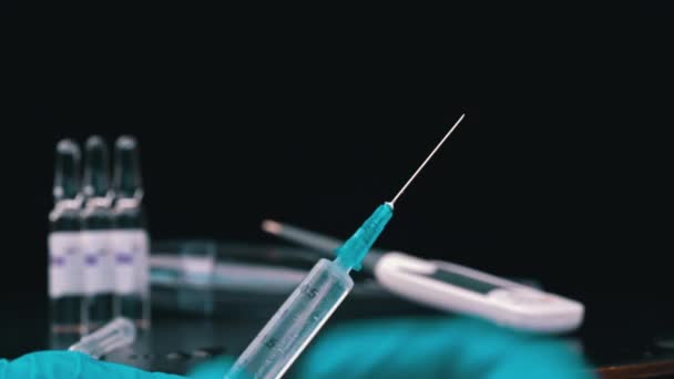 Nurse Prepares a Syringe And Medicine Drips from It in Large Drops Close-up — Video Stock