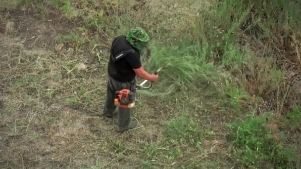 Man Special Uniform Mows Grass Benzo Mower Mow Grass Spring — Stok video