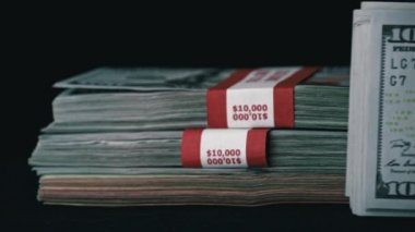 One hundred dollar bills in the hands of a girl, redrawing money. Banking system, monetary relations. Cash in banknotes.