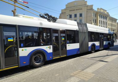 Latvia, Riga.  Ukrainian symbols in the capital of Latvia. Stickers with the colors of the Ukrainian flag on the entrance doors of public transport in Riga.