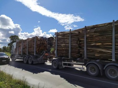 Latvia, Riga. The situation on the roads. Removal of the forest. Logging truck with wood on the road.