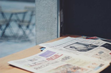 Newspapers on a table in a coffee cafe
