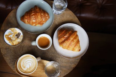 Coffee and croissants in a coffee bar
