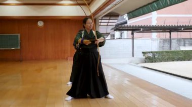 Kyudo practicing bow shooting in Kyoto, Japan. Archery.