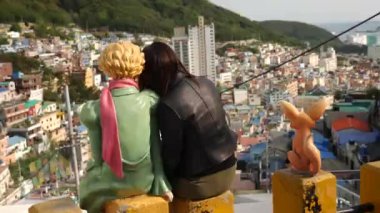 Busan, South Korea - July 23, 22: Popular tourist attractions The Little Prince in the Gamcheon Culture Village. Nickname is Machu Picchu of Busan. High quality 4k footage