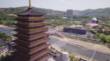 Aerial footage of a Scenic view of tall eight floors pagoda in traditional korean style village in Gyeongju in South Korea. Close to Expo areal. High quality 4k footage.