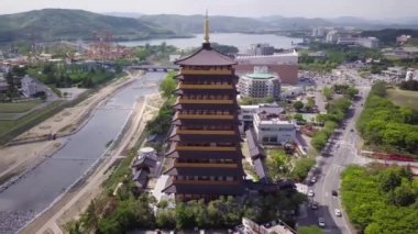 Aerial footage of a Scenic view of tall eight floors pagoda in traditional korean style village in Gyeongju in South Korea. Close to Expo areal. High quality 4k footage.