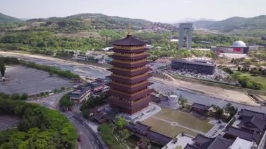 Aerial footage of a Scenic view of tall eight floors pagoda in traditional korean style village in Gyeongju in South Korea. Close to Expo areal. High quality 4k footage.