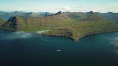 Aerial view of a Funningur Scenic Point, Faroe Islands. Sunny day in summer. Amazing nature in Faroe Islands. Eysturoy Island. Gonguturur or Hvithamar Trailhead. High quality 4k footage