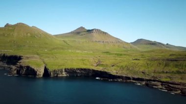 Aerial view of a faroese mountains, Faroe Islands. Sunny day in summer. Amazing nature in Faroe Islands. The top of the Summits in Faroe islands. Eysturoy Island. Gonguturur or Hvithamar Trailhead.