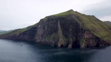 Aerial view of the Witches Finger, Trollkonufingur in Faroe Islands. Morning light. High quality 4k footage.