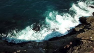Aerial view of an atlantic ocean crashes into the rocks in Faroe Islands. 4k footage