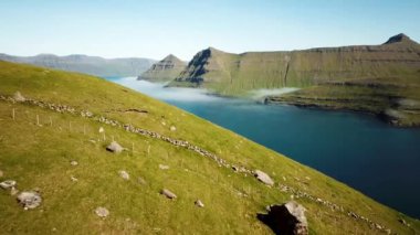 Aerial view of a Funningur Scenic Point, Faroe Islands. Sunny day in summer. Amazing nature in Faroe Islands. Eysturoy Island. Gonguturur or Hvithamar Trailhead. High quality 4k footage