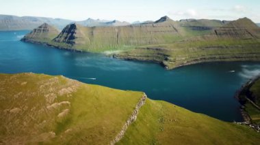 Aerial view of a Funningur Scenic Point, Faroe Islands. Sunny day in summer. Amazing nature in Faroe Islands. Eysturoy Island. Gonguturur or Hvithamar Trailhead. High quality 4k footage