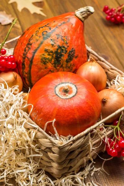 Two Orange Pumpkins Onions Wicker Basket Straw Basket Wooden Background — Stock Photo, Image