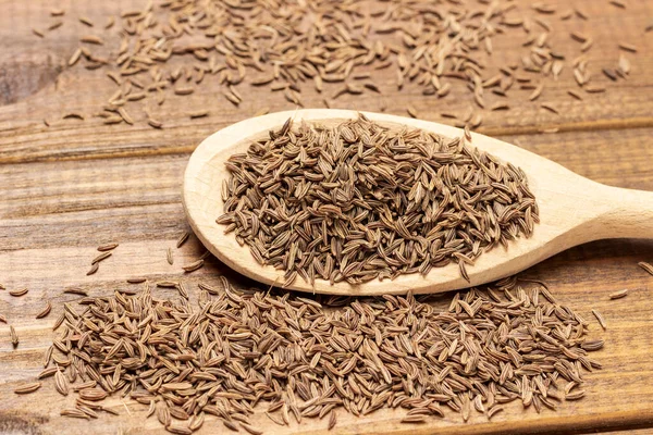 Semillas Comino Cuchara Madera Cerca Vista Superior Fondo Madera — Foto de Stock