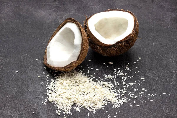 Two Halves Coconut Coconut Flakes Black Background Top View — Foto Stock