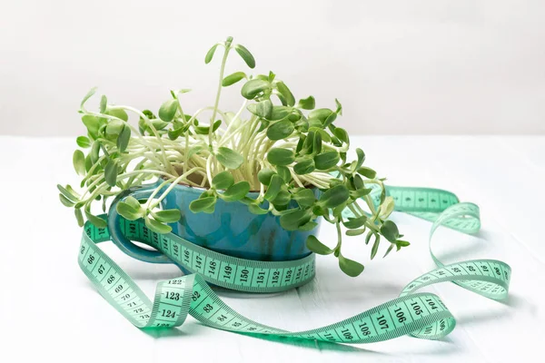 Measuring Tape Blue Mug Sunflower Sprouts White Background Top View — Stock fotografie