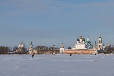 Temples of the city of Rostov the Great on the shore of the lake in winter