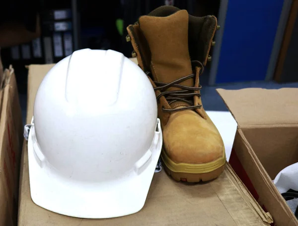 Safety shoes and safety helmet are Safety equipment for workers when working in construction to avoid work accidents