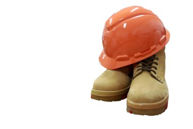 Safety helmets and boots made of leather are equipment that workers must have when working in construction, to protect their feet and heads.