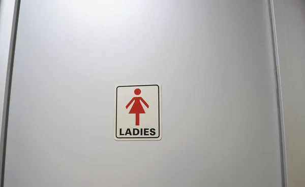 women only bathroom sign or logo