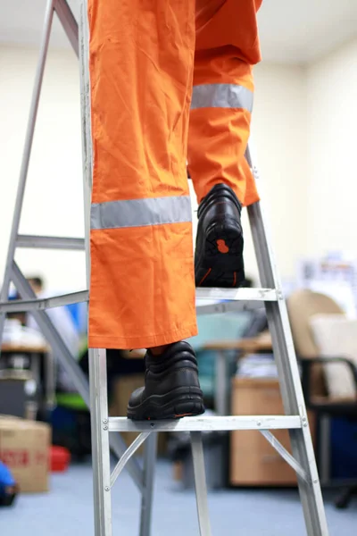 Workers Climbing Stairs Wearing Safety Shoes — 图库照片