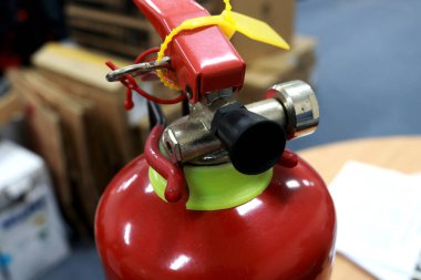 A fire extinguisher is an active fire protection device used to extinguish or control small fires, often in emergency situations. can also be called a small extinguisher for indoor
